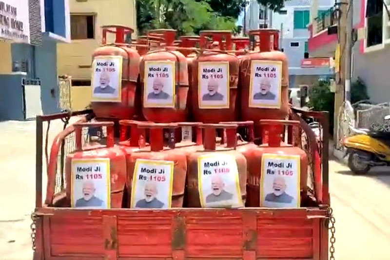 LPG CYLINDER MODI PIC TRS hits back at FM with PM's pictures on LPG cylinders