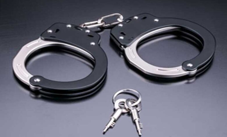 Hand Cuff Hyderabad Police Arrest Two Individuals for Online Cheating and Forgery