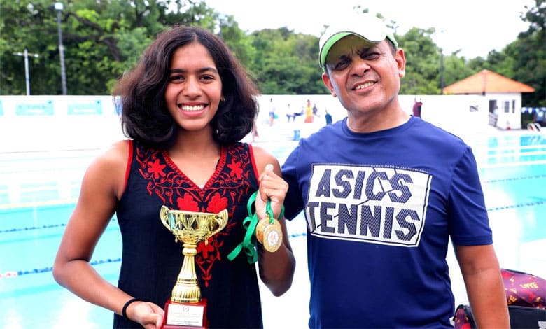 VRITTI AGARWAL WITH COACH Telangana's Vritti Agarwal Secures Double Gold at 67th National School Games Swimming Championship