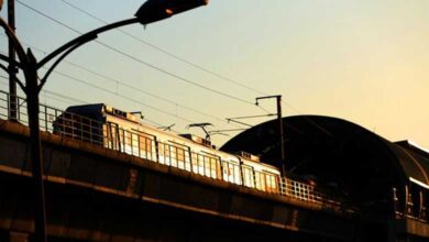 Man standing atop truck dies after his head hits metro station beam