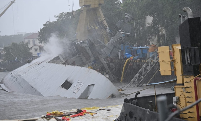 INS Brahmaputra fully tilts onto one side after onboard fire at Mumbai docks