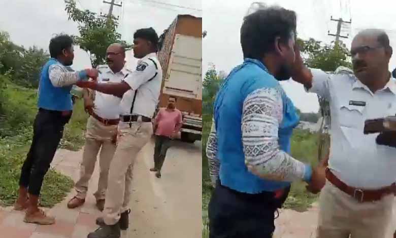 Telangana News | Traffic cop transferred for manhandling, abusing driver