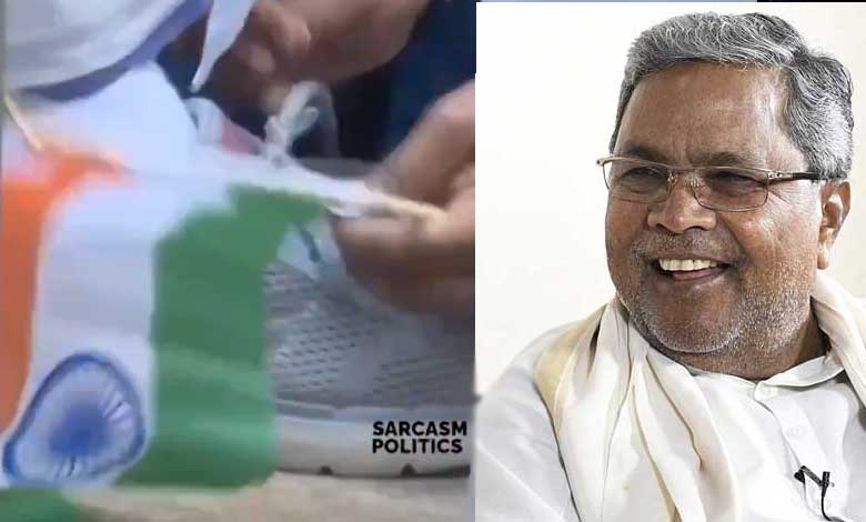 Disrespect to National Flag as Karnataka CM Siddaramaiah Holds It While Congress Worker Unties Shoelaces