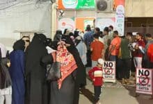 Residents submit ration card applications at a MeeSeva center in Telangana.