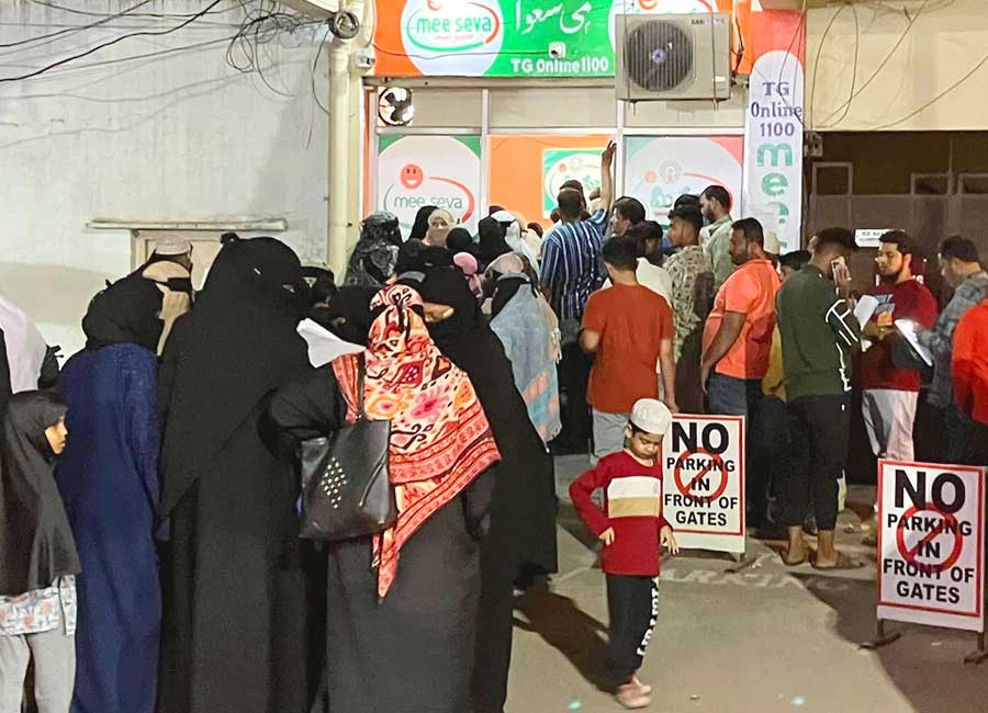 Residents submit ration card applications at a MeeSeva center in Telangana.