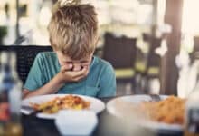 A pediatrician advises a parent on managing food poisoning symptoms in Hyderabad.