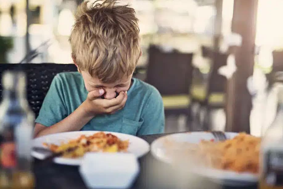 A pediatrician advises a parent on managing food poisoning symptoms in Hyderabad.