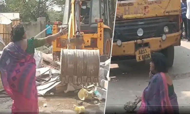 Outrage in Uppal: Woman's Shocking Protest Against GHMC Booth Demolition!