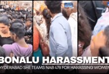SHE Teams personnel apprehending an individual for harassing women devotees amidst the crowded Bonalu celebrations in Hyderabad.