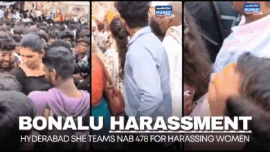 SHE Teams personnel apprehending an individual for harassing women devotees amidst the crowded Bonalu celebrations in Hyderabad.